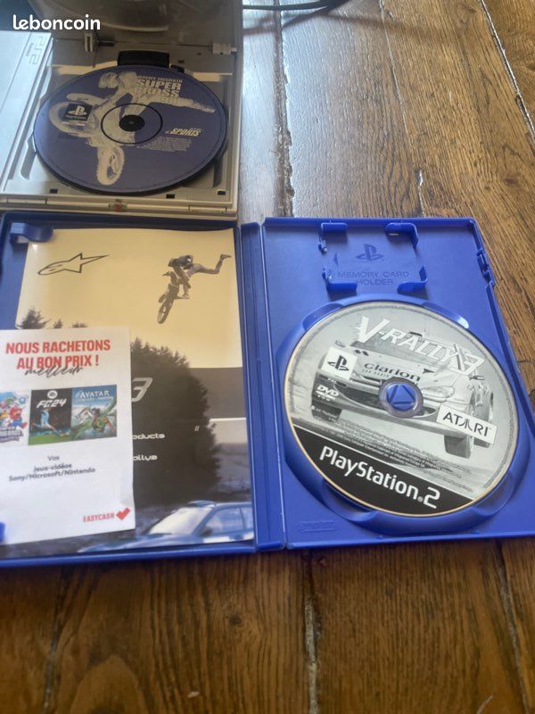 PS2 slim grise avec 2 manettes et 2 jeux (image 2)