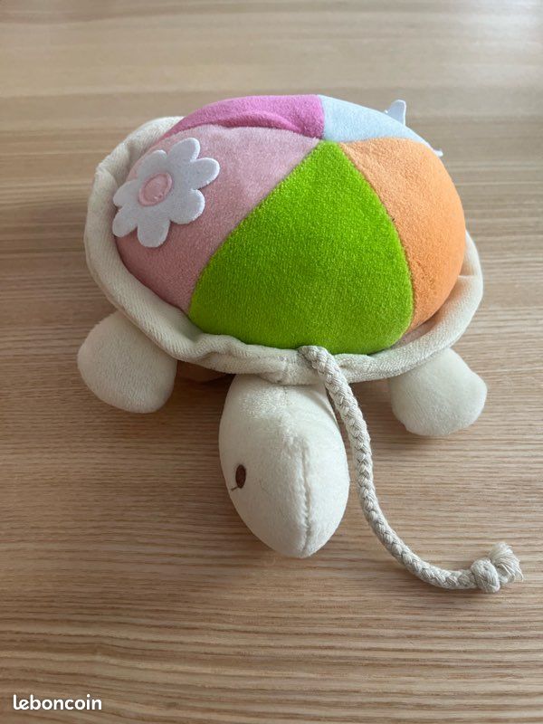 Tortue avec grelot en peluche (image 1)