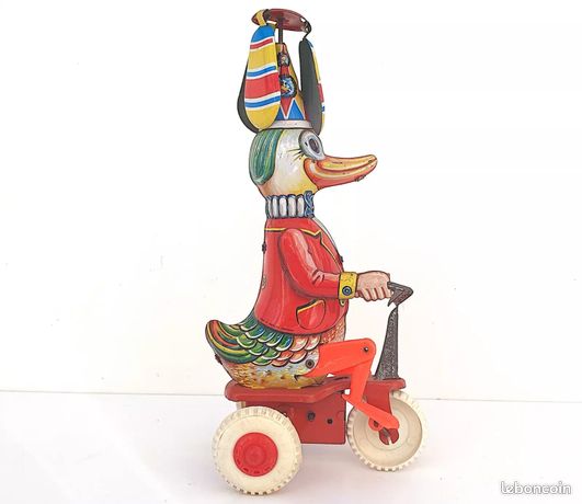 Jouet canard vintage en métal à remonter sur vélo - Dans sa boîte d'origine - France Jouet canard vintage en métal à remonter sur vélo - Dans sa boîte d'origine - France
