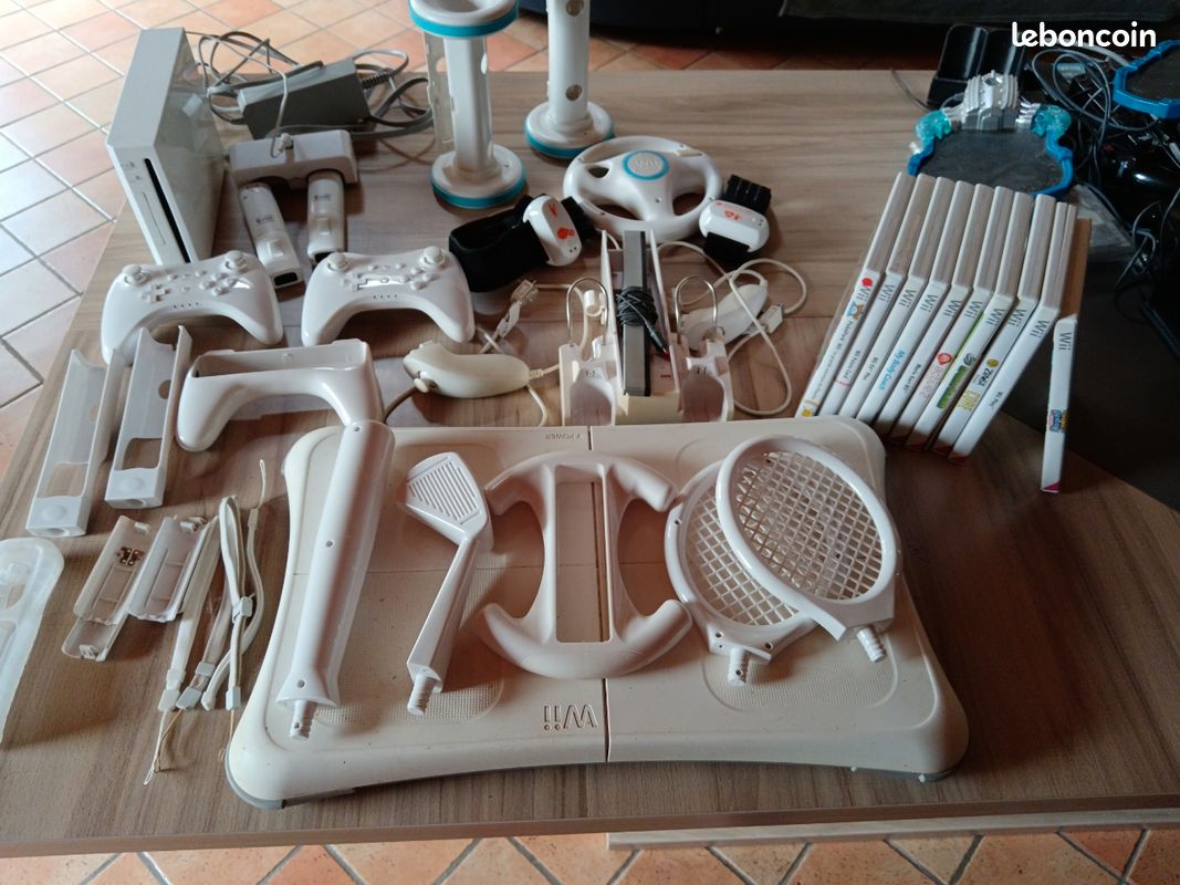 Vends Wii fit avec jeux et accessoires (image 2)