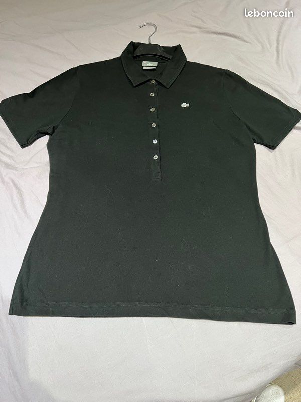 Polo noir MC femme LACOSTE Taille 46 (image 1)