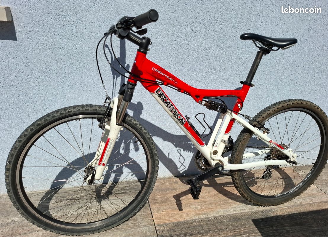 Velo Vtt Rockrider tt suspendu alu 26 pouces 24 vitesses