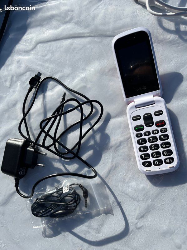 Ensemble téléphone , chargeur fil bluteout (image 1)