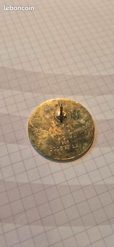 Pin's ANNEAUX OLYMPIQUES JO gris fond blanc siglé 1988 COOB'92 S.A - Collection