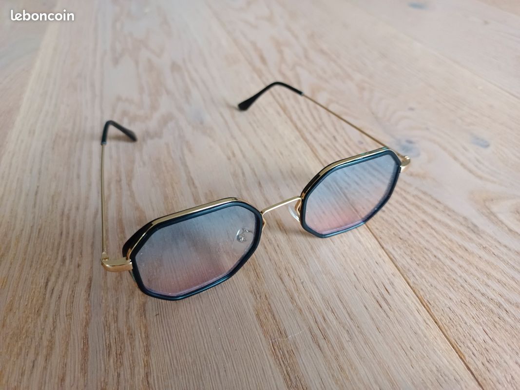 Lunettes homme dorées et bordées de notre (image 1)