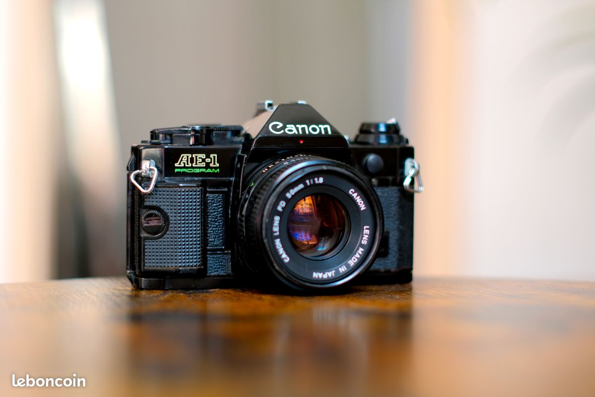 Alsace-photo Canon AE-1 noir + objectif FD 50mm f/1.8 chrome nose + 1 pellicule Agfa APX 400 offerte - Photo, audio & vidéo