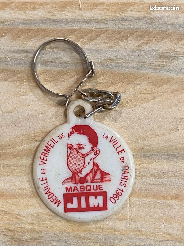Ancien porte-clés en plastique "Masque JIM - Médaille de Vermeil de la Ville de Paris" (image 1)