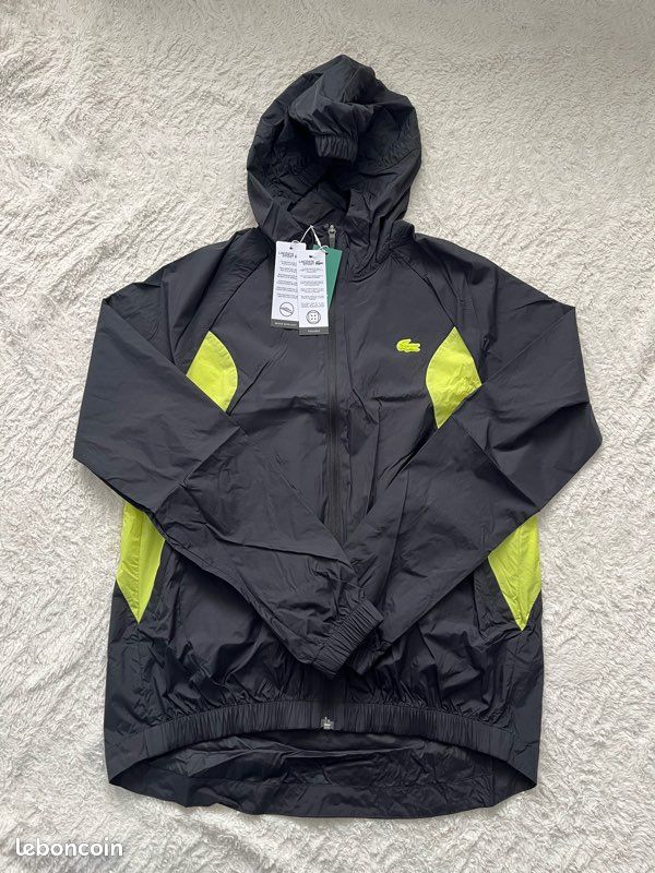 Veste Lacoste coupe vent noir et jaune fluo neuf Vêtements