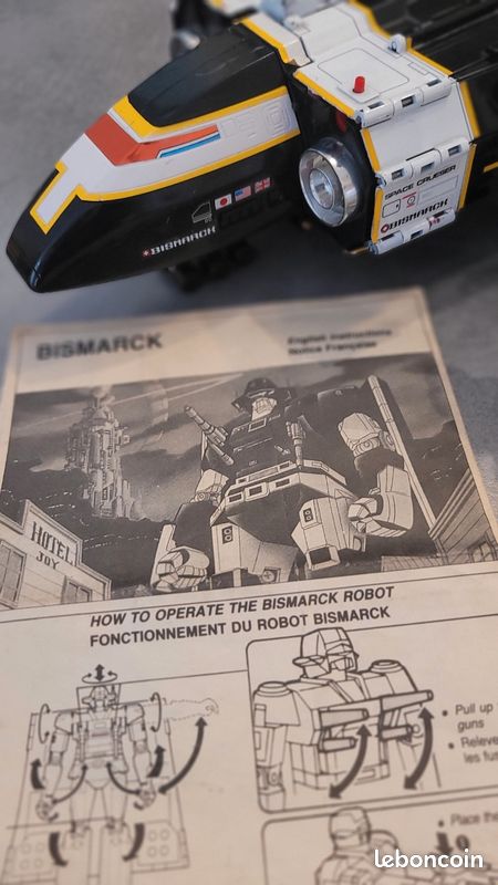 Robot Bismarck et sa navette Bandai 1985 vintage avec notice missiles et pistolet - Collection