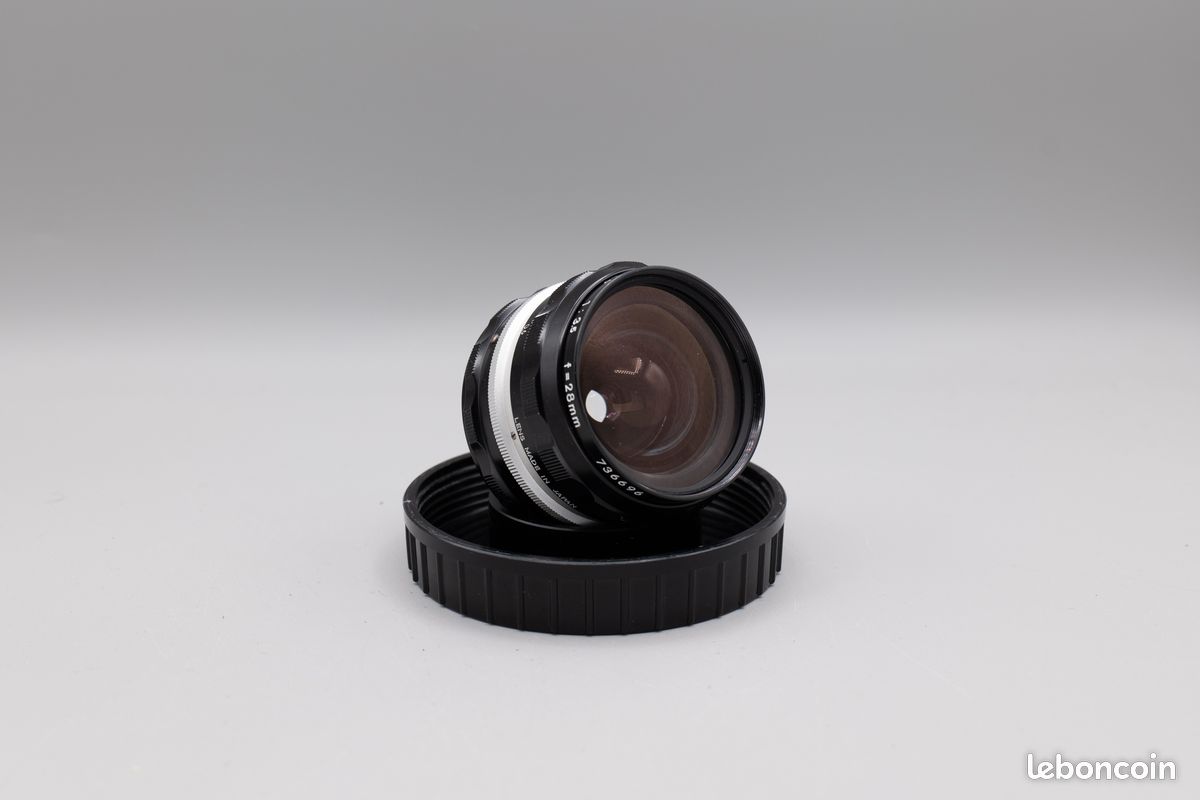 OBJECTIF A.I NIKON NIKKOR-H.C AUTO 28mm 1:3.5 + FILTRE NIKON