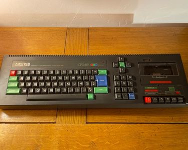 Photo Amstrad CPC 464 keyboard and monitor displaying a retro computer game | Adobe