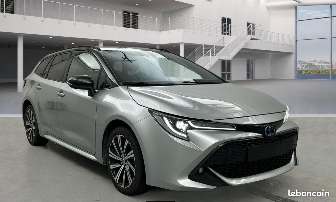 TOYOTA COROLLA TOURING 1.8i 122 HK HYBRID SPORTS ACTIVE PREMIUM CVT 22 990 ou 385/MOIS (image 1)