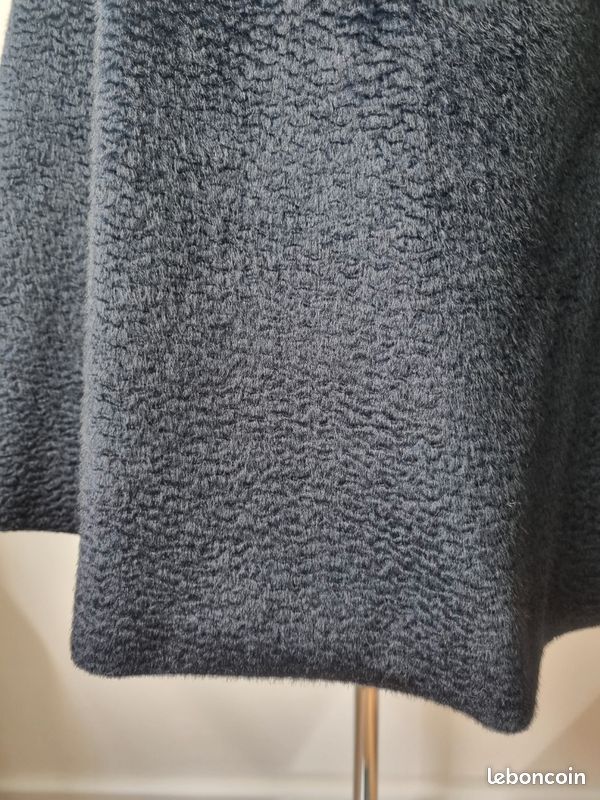 Mini jupe trapèze bleu marine en laine avec fente arrondie