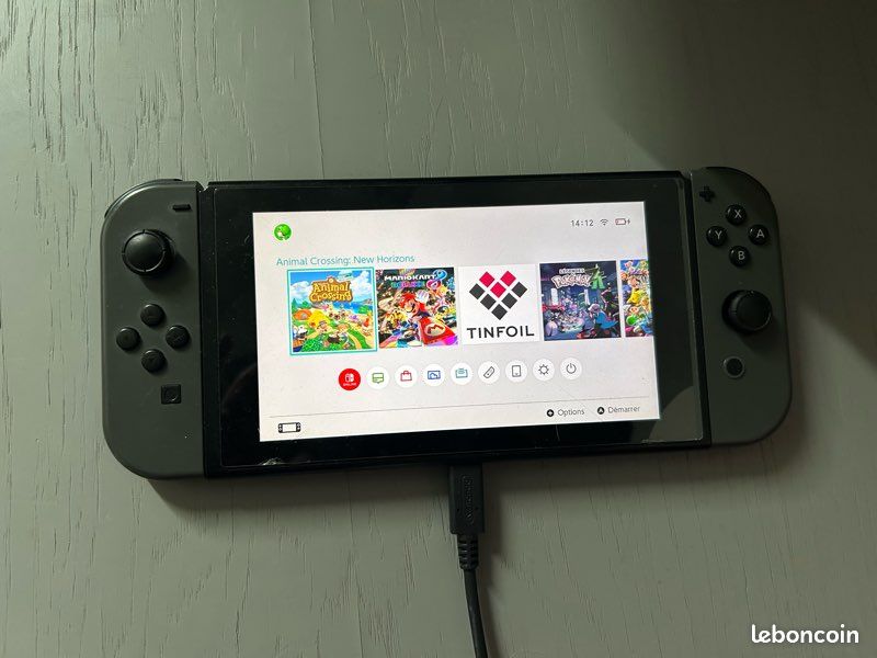 Switch 1 avec joycon et jeux et connecteur tv (image 1)