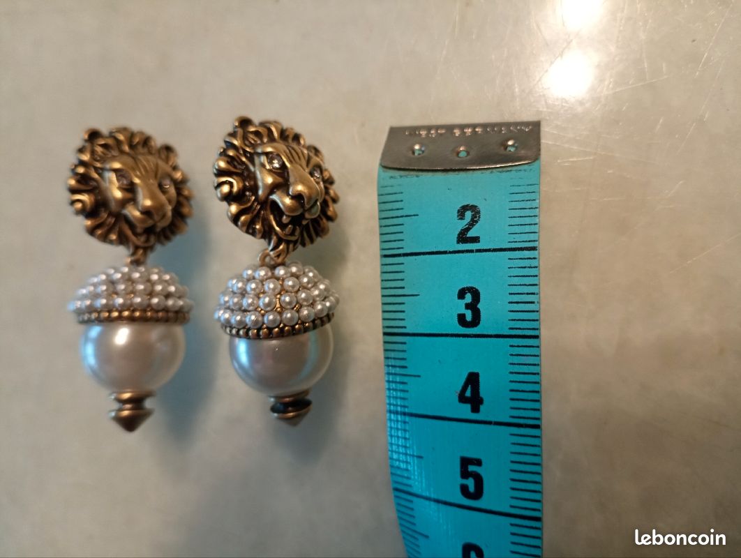 Boucles d'oreilles lion couleur bronze (image 1)