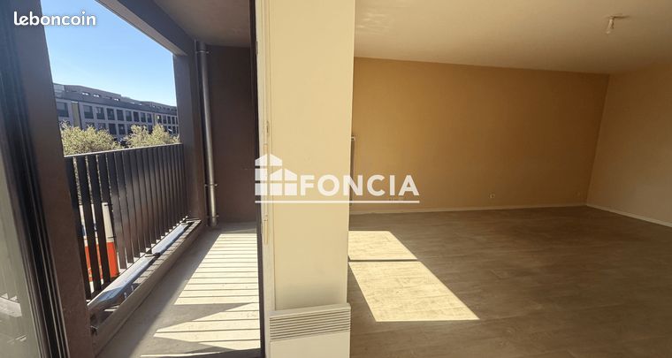 Appartement type 3 avec balcon et parking privatif en sous-sol