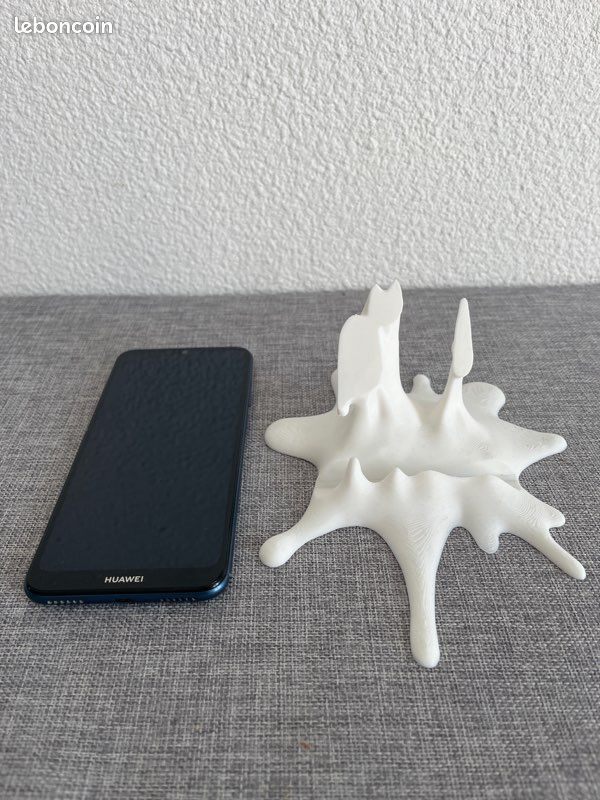 Support téléphone original effet éclaboussure (image 1)