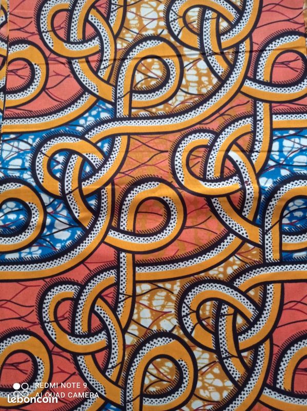 Couture patchwork Tissu wax 3m98 x 1m13 orange, bleu avec des dessins de boucles (image 1)