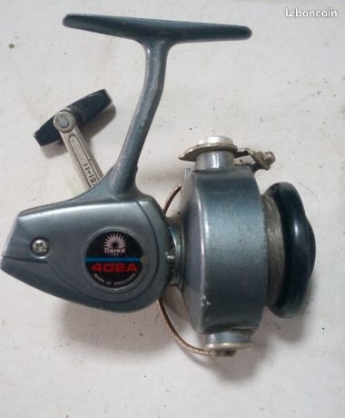 ancien moulinet capoté DC70 (Daiwa?) , 270 grs, en très bon état