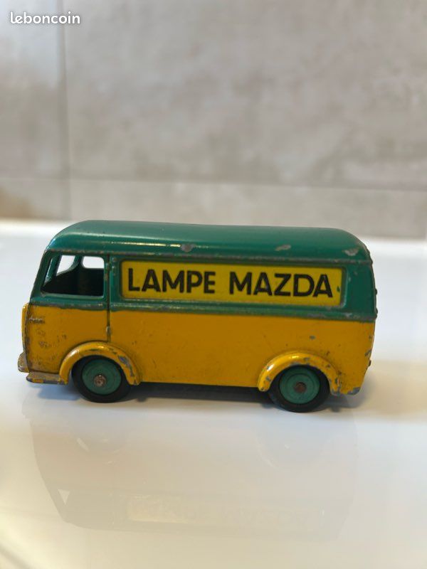 Dinky - Dinky Toys Atlas 1/43 - Fourgon Tolé Peugeot Lampe Mazda