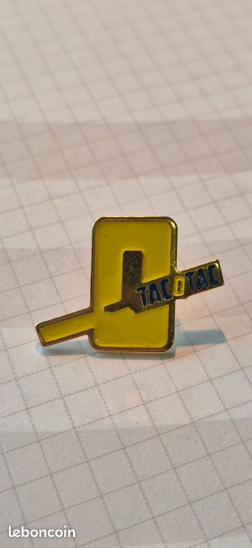 Pin's Tac o Tac jaune (image 1)