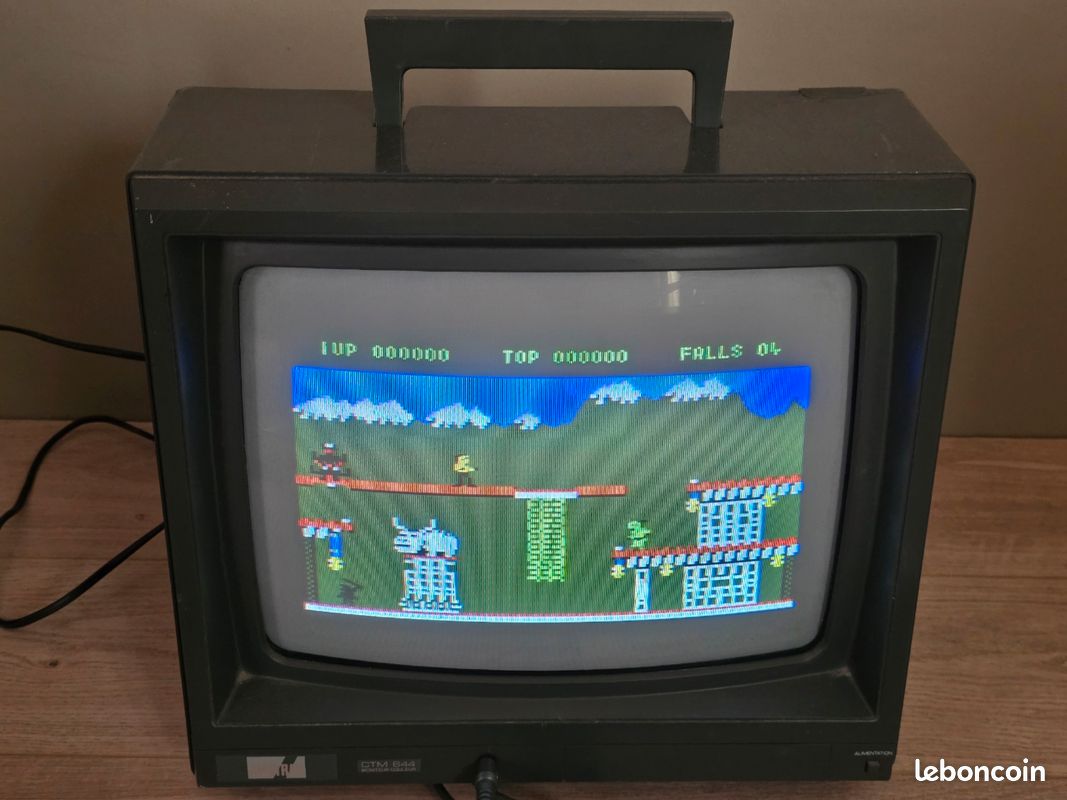 AN AMSTRAD CPC64 COLOUR PERSONAL COMPUTER AND A POLAROID CAMERA