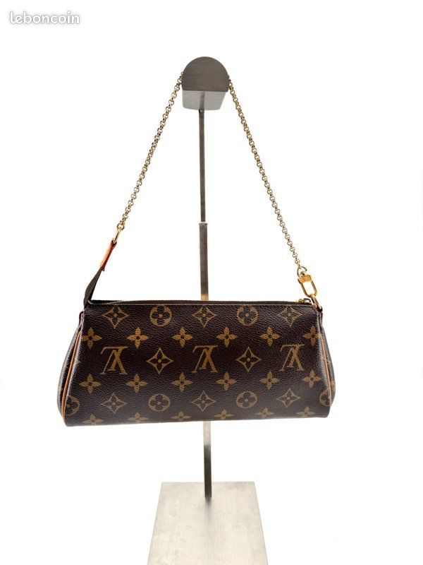 Pochette Louis Vuitton Eva en toile Monogram, chaîne dorée et