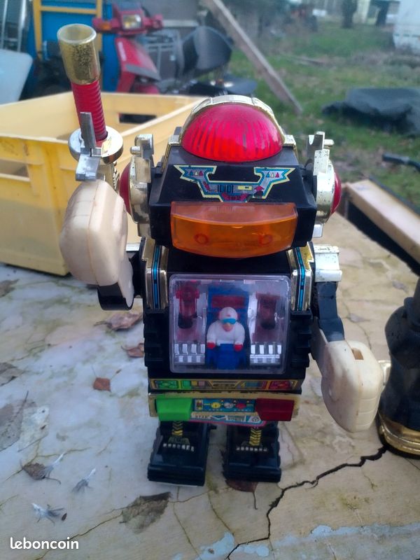 Three Vintage Toy Robots and a Table Clock