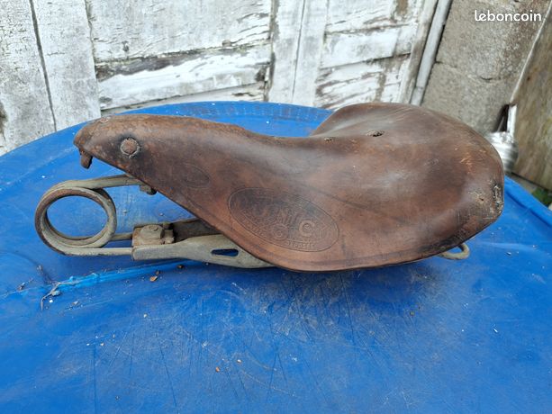 Ancienne selle de vélo en cuir à ressorts UNIC
