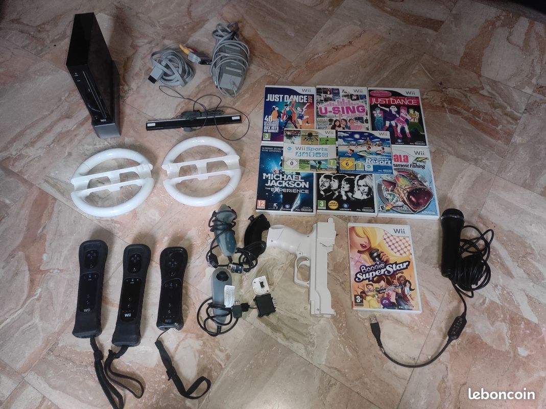 Console de jeux Wii + accessoires + jeux (image 1)