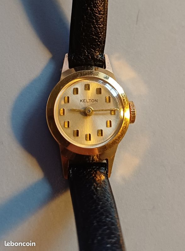 Montre Vintage KELTON Mécanique Manuelle - Argentée, Ronde, Ne Fonctionne Pas (balancier Oscille), Occasion