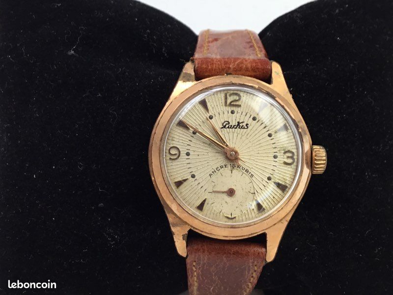 Montre AFRICA PRIMA PRIMA Mécanique Manuelle 1960 - Boîtier Plaqué Or, Cadran Argenté, Bracelet Cuir Noir - Homme