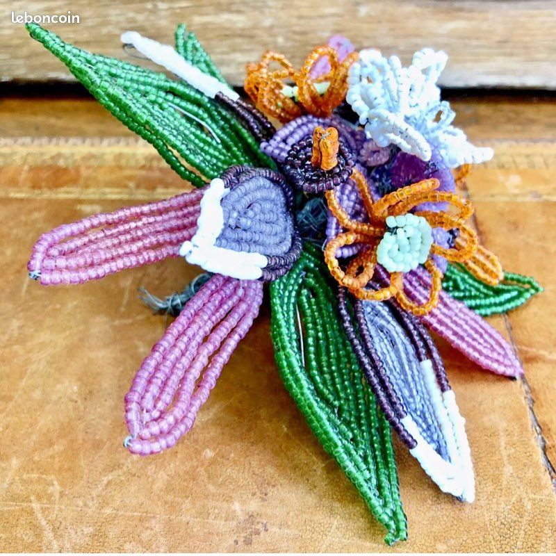 Broche en forme de papillon en argent et émail avec perle