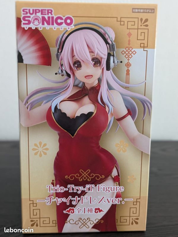 Good - Get ready to groove with Super Sonico as she takes the stage in FuRyu's dazzling new Trio-Try-iT figure! Adorned in a vibrant China Dress and wielding a festive red fan