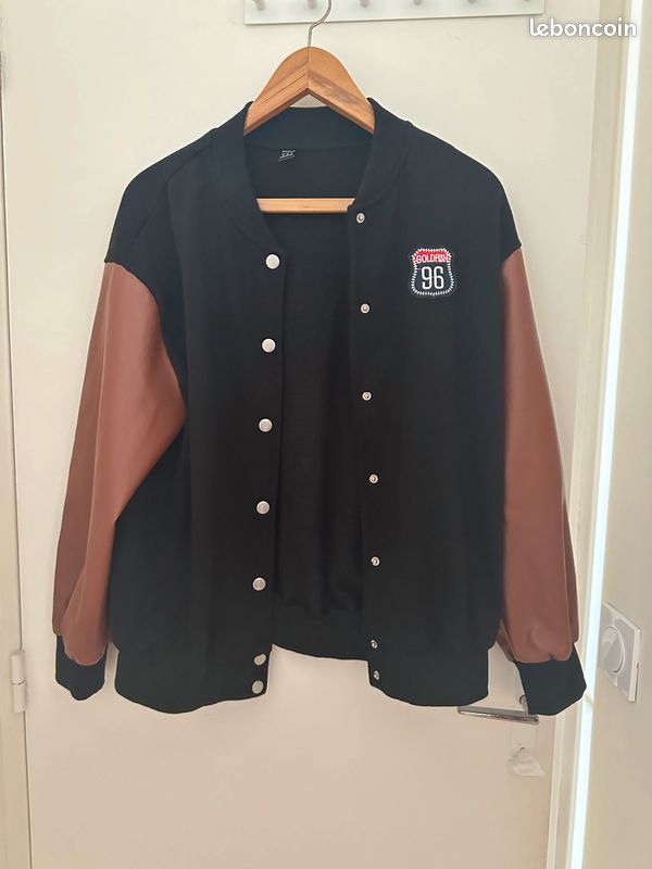 Veste noire et marron (image 1)