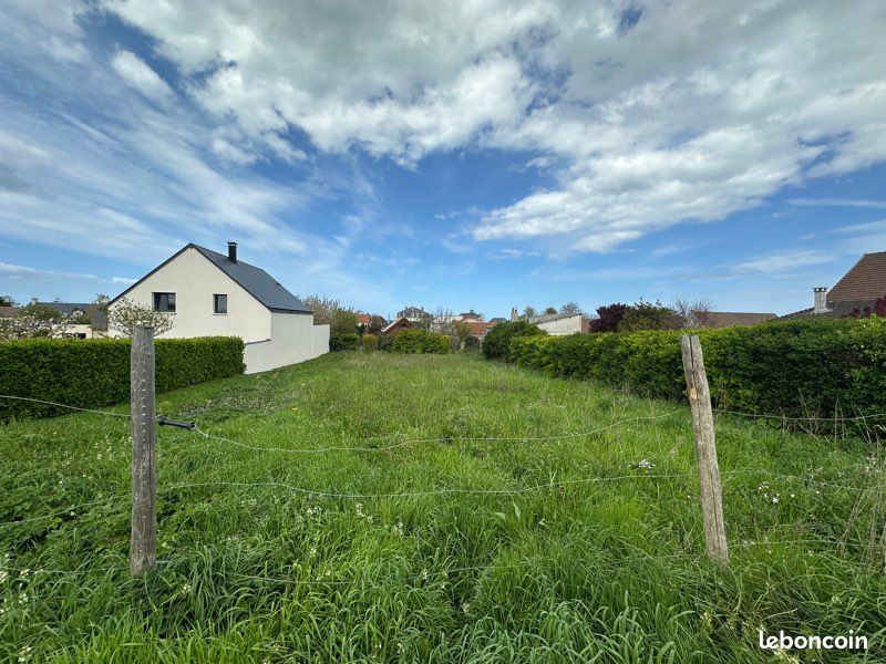 Grand terrain constructible avec maison · à Asnelles · 335 000 €