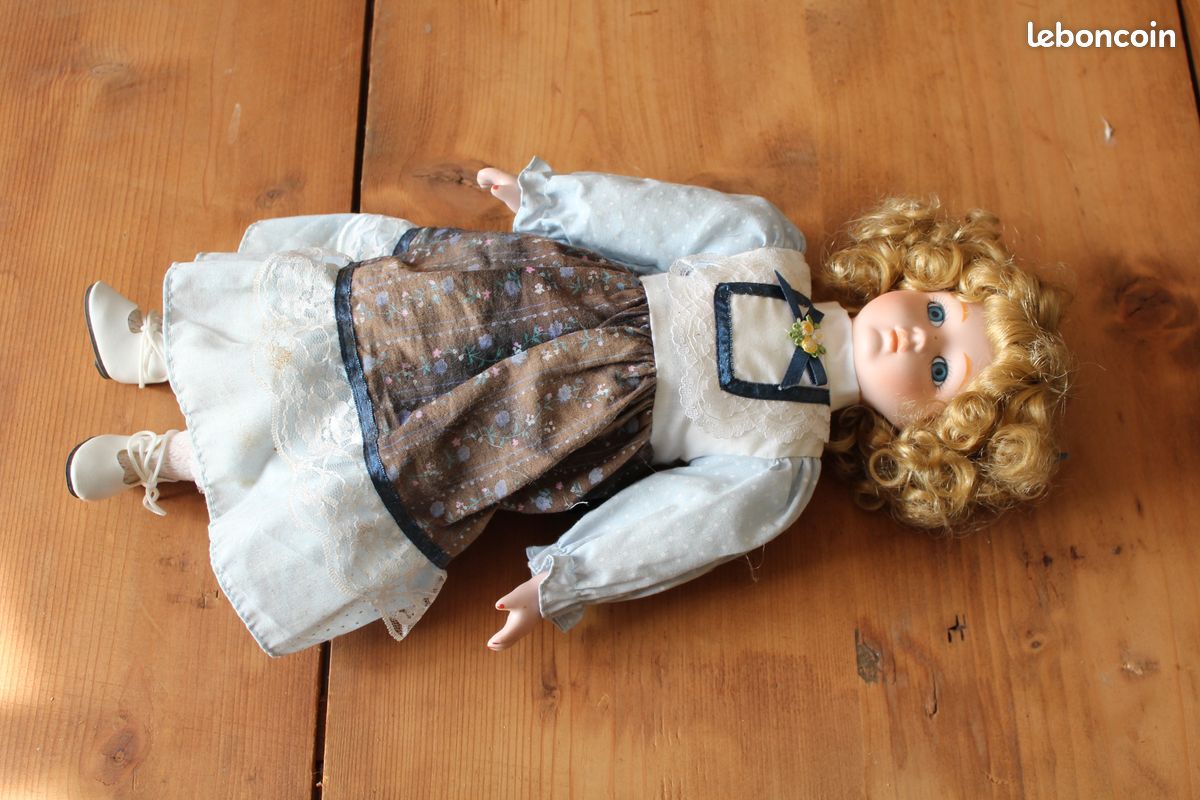 Poupée en porcelaine (image 1)