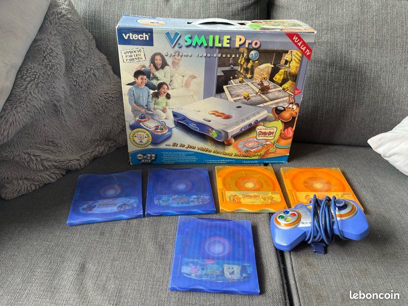 console vsmile motion vtech rose, 2 manettes avec jeux dora motion vf