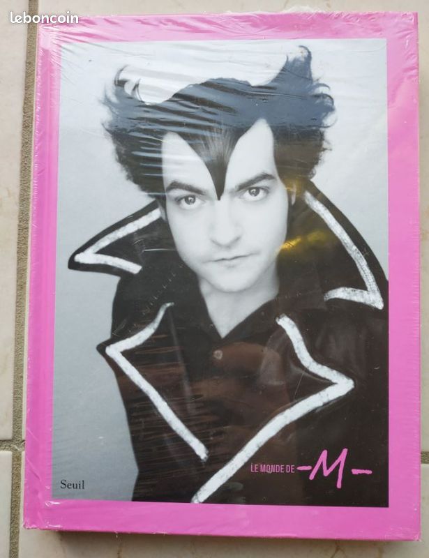 Livre "Le monde de M" (neuf sous blister) (image 1)