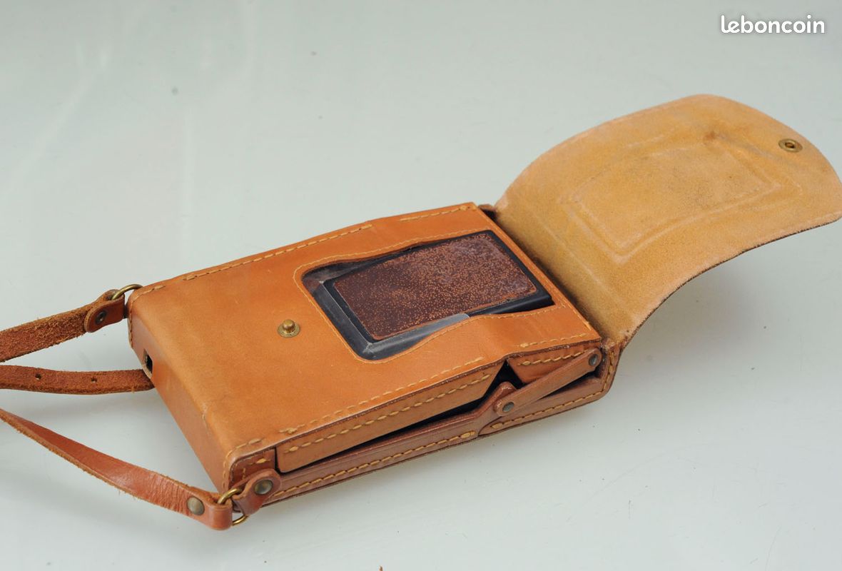 A Polaroid SX-70 Land Camera w/ Original Leather Case
