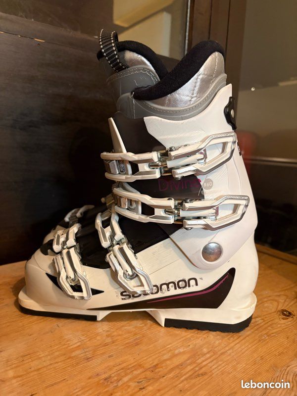 salomon divine r60 ski boots  Lone Pine Gear Exchange Set your sights on an aggressive slope and let the Salomon Divine RS CF ski boots help you master the skills to ski it like a proSalomon Divine RS CF Ski Boot Womens Specs Second Skin Last envelops the foot with a performance anatomic fit so every bit of control pressure is transferred to the ski Spaceframe Shell Profile with multilayer construction and precise wall thicknesses optimizes feeling performance and energy transmission Thinwall construction of the Second Skin Shell creates a light sensitive boot providing superior fit and feel Energyzer shell reinforcement provides a progressive and responsive flex Bimaterial polyurethane shell accommodates easy entry excellent foot envelopment and progressive flex Soft 2D Sensifit material over the forefoot and up the front of the shell enhances comfort and ease of entry My Customfit Sport liner featuring a layer of conformable foam customizes the fit along the front of the ankle Biovent liner technology employing layers of mesh foam and insulation effectively transfers moisture away from feet Liner captures 30 to 50 more water than a standard liner thereby keeping feet dry and warm Womenspecific liner features faux fur fleece lining and an upper cuff shaped to accommodate womens calf muscles Loop on tongue aids pulling the boot on and taking it off A simple turn of a screw frees up 1cm of extra room around the cuff Microadjustable aluminum buckles let a woman tailor boot snugness for comfort and performance Toolfree catches are quickly adjusted to fit various ankle widths Ski Boot Salomon Divine R60