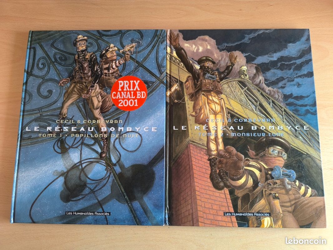 Lot Tomes 1 et 2 BD Le Réseau Bombyce
Tome 1. Papillons de nuit
Tome 2. Monsieur Lune

Très bon état, hormis les coins frottés.
Le lot uniquement (image 1)