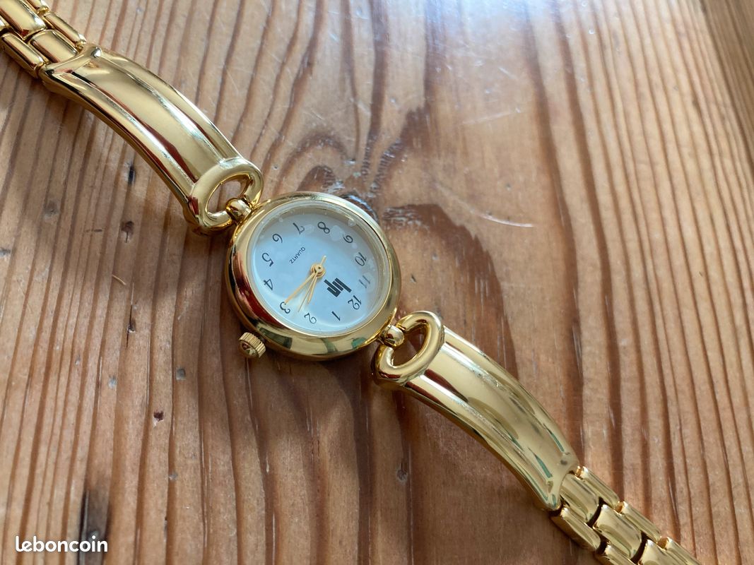 Montre LIP femme acier doré jaune bracelet cuir noir