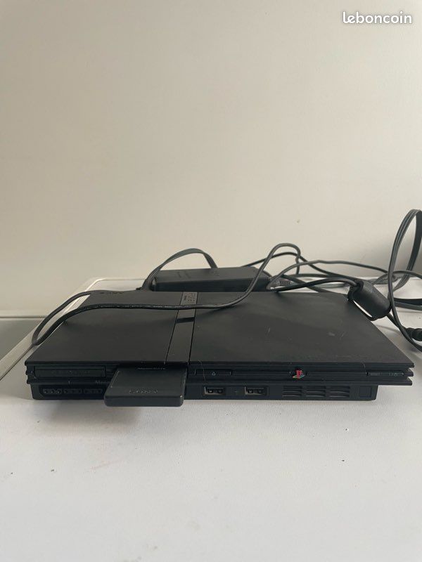 PlayStation 2 slim + manettes + jeux (image 1)