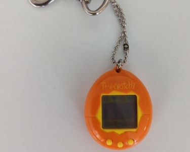 Tamagotchi Original P1/P2 Yellow w/ orange Bandai 1997 English - Buy