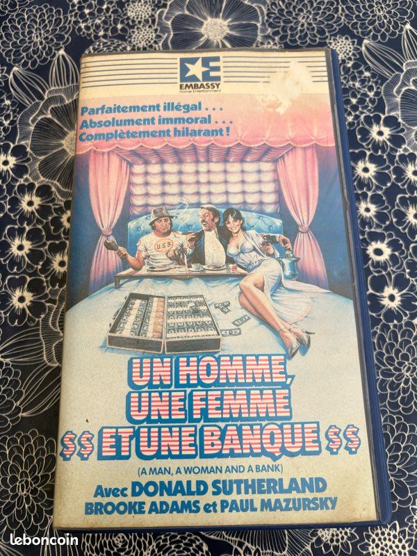 VHS - un homme une femme et une banque (image 1)