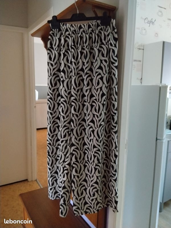 Pantalon large femme marqué taille ml sa fait 38/40 comme neuf (image 1)