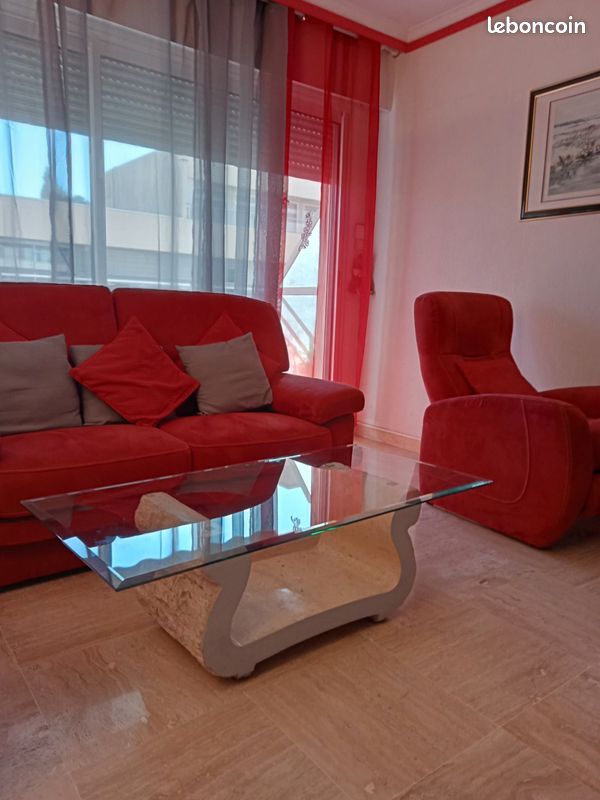 Table basse socle pierre et plateau en verre (image 1)