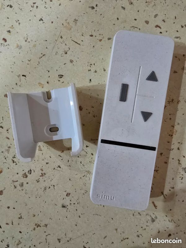Télécommande SIMU pour volet roulant – 3V CR2430 – avec support mural (image 1)