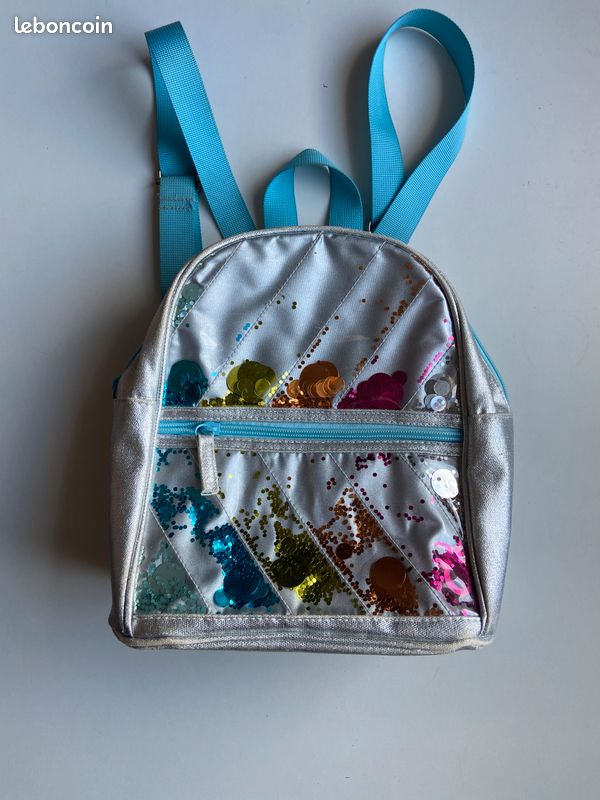 Petit sac à dos fille – Arc-en-ciel paillettes et bretelles bleues